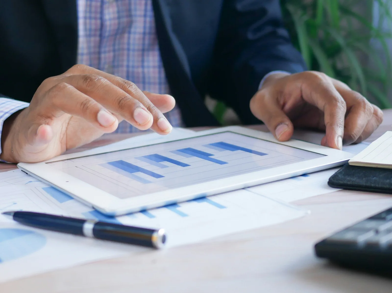 Reviewing business reports on a tablet